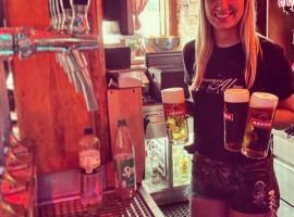 Pretty blondie serving beer for stag groups in Hamburg