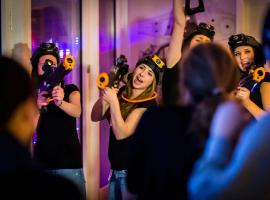 Female stag group aiming a laser fully immersed in the high-stakes Hamburg battlefield